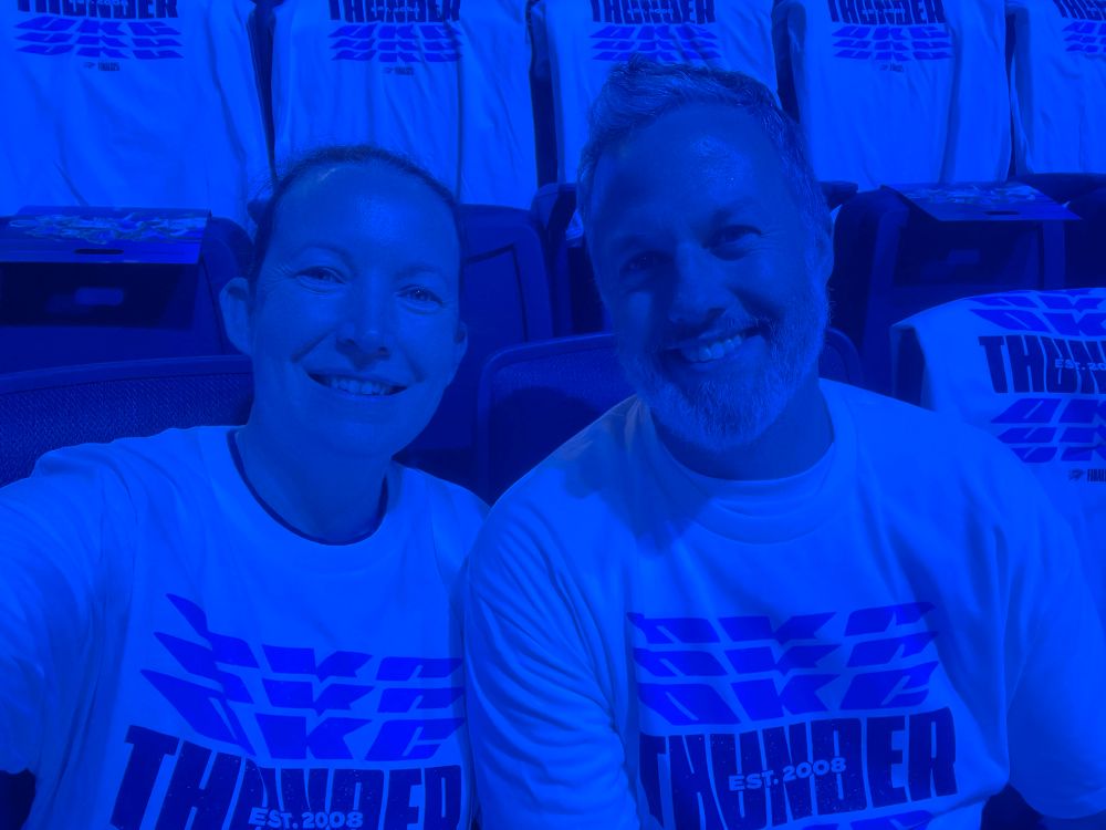 In white OKC Thunder shirts. 