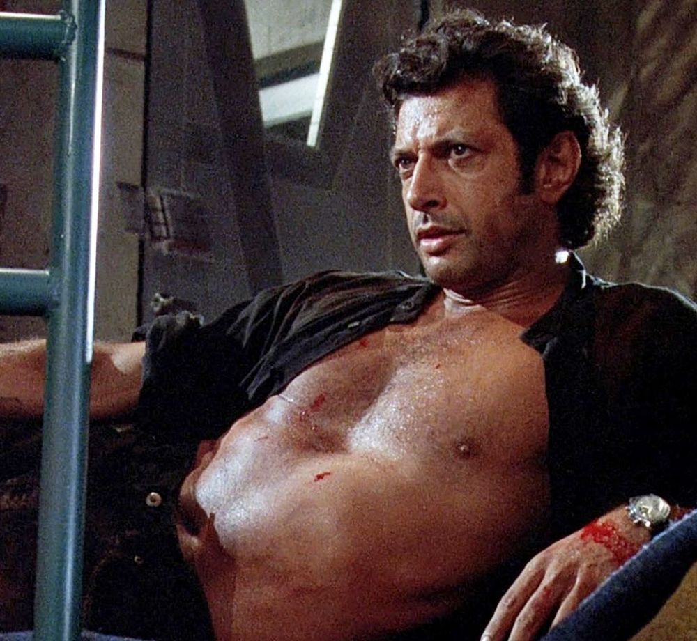 dr ian malcolm in jurassic park
shirt wide open and a little blood on him 