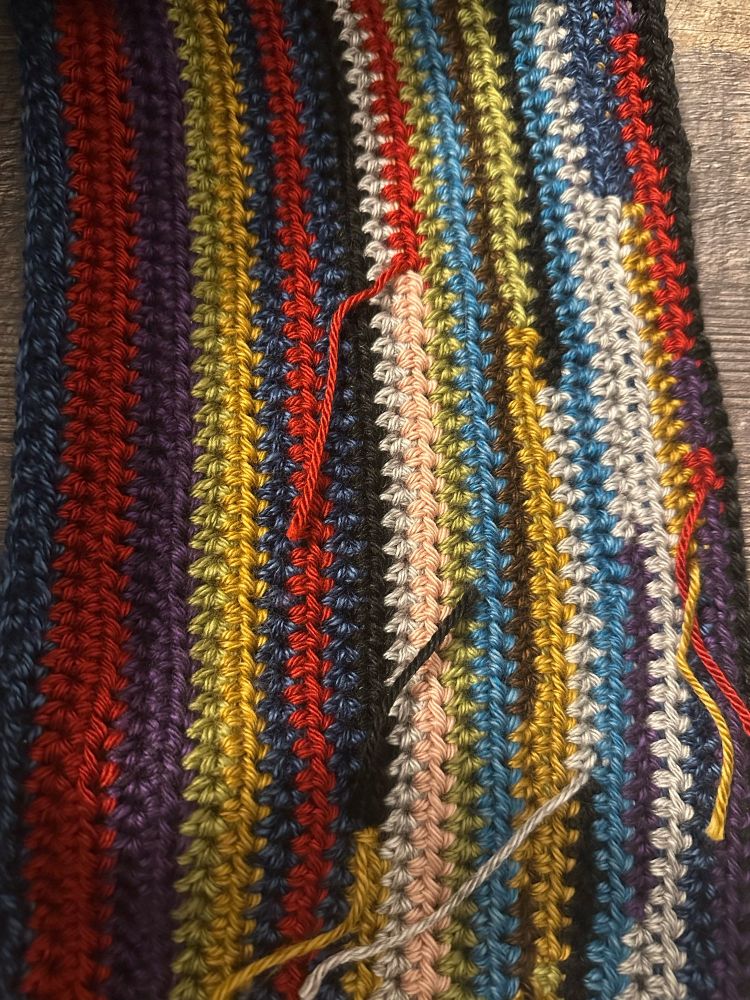 A new black row is added with two kinds of stitches to distinguish the two songs in the mashup (they are likely hard to tell apart here)