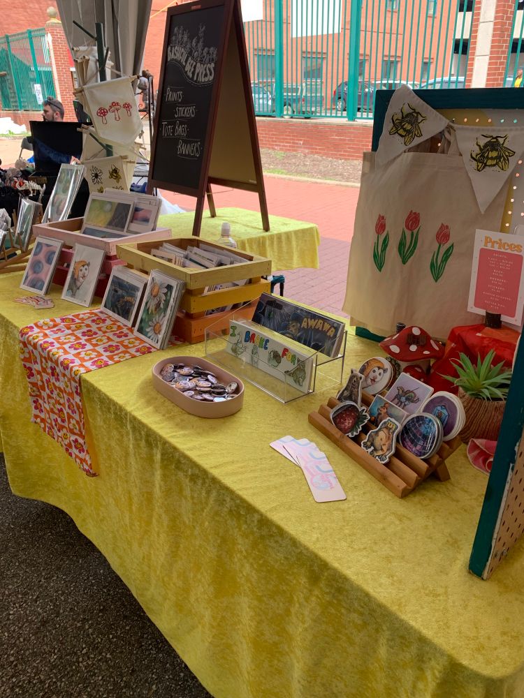 Yellow table cloth with art merchandise 