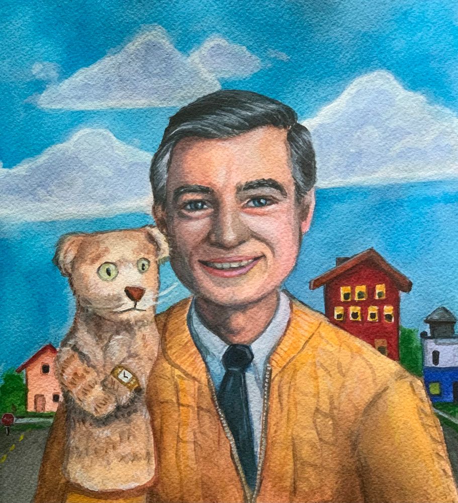 Zoomed in image of man holding a Tiger puppet 