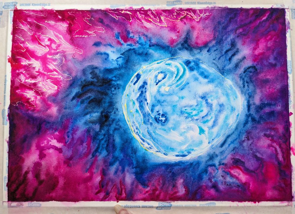 A picture of a watercolour painting by Random_Violette. It is a work in progress inspired by the bubble nebula. Featuring a vibrant blue, circular bubble floating amongst the gaseous clouds of space. These surrounding clouds consist of blues, purples and pinks. The piece currently looks more like an abstract psychedelic piece than a nebula, but as we add the darker colours of space, the vibrant colours will pop all the more and look more like a nebula.
