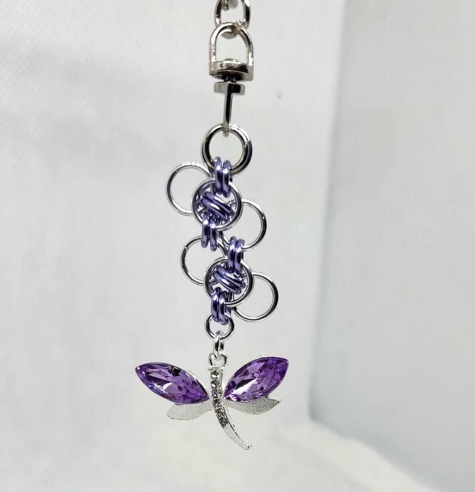 Silver and purple chainmail keychain with dragonfly charm at the end.