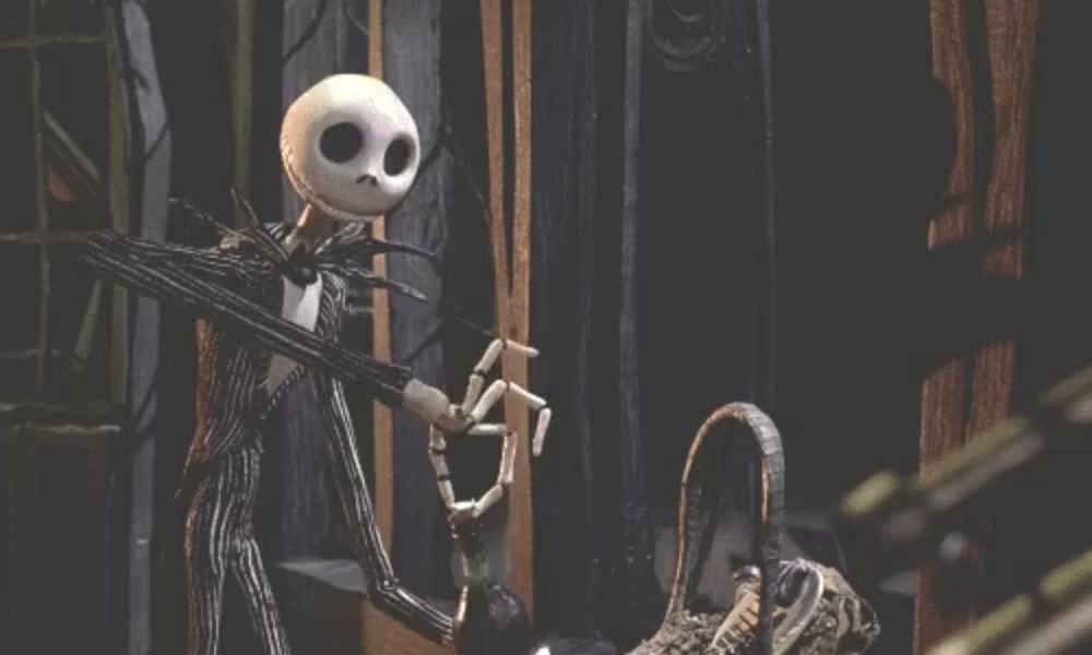 jack skellington from the nightmare before christmas standing next to a basket and a bottle