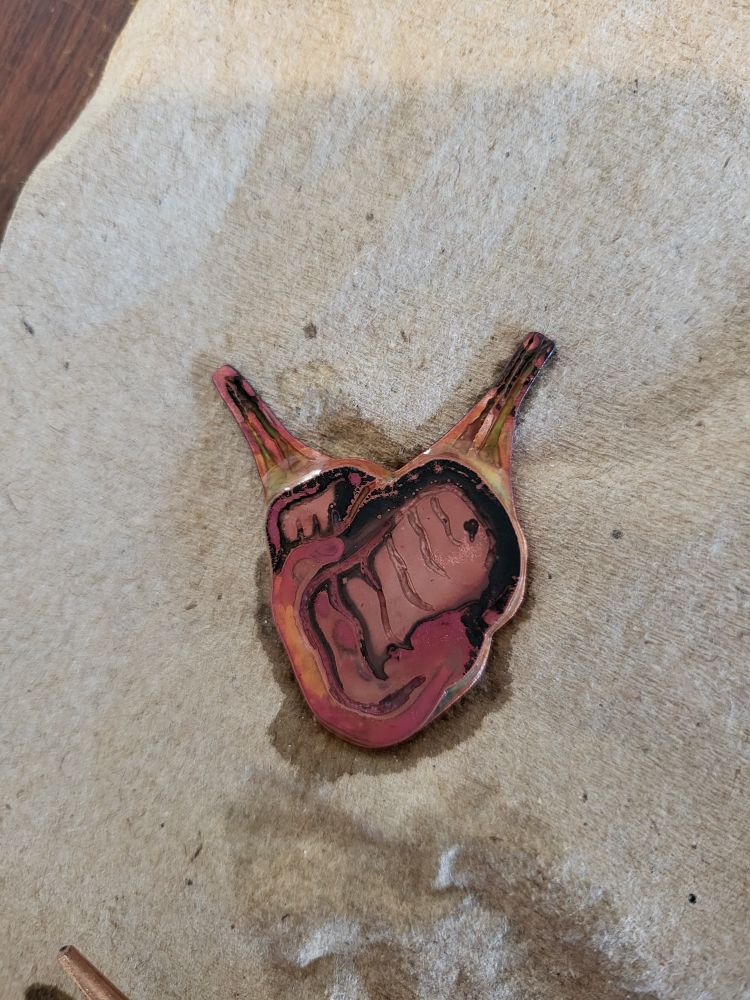 a copper heart that was soldered together