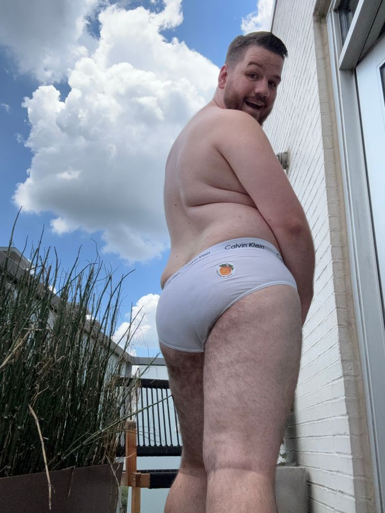 Photo of me from the back on my balcony wearing white briefs with a GA I Voted sticker on my ass 
