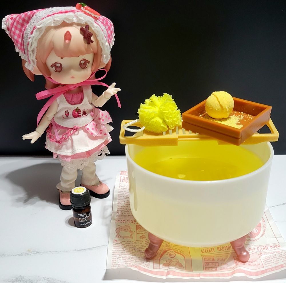 a mini doll inviting you to a mini bath with mini yuzu bath bombs!!!