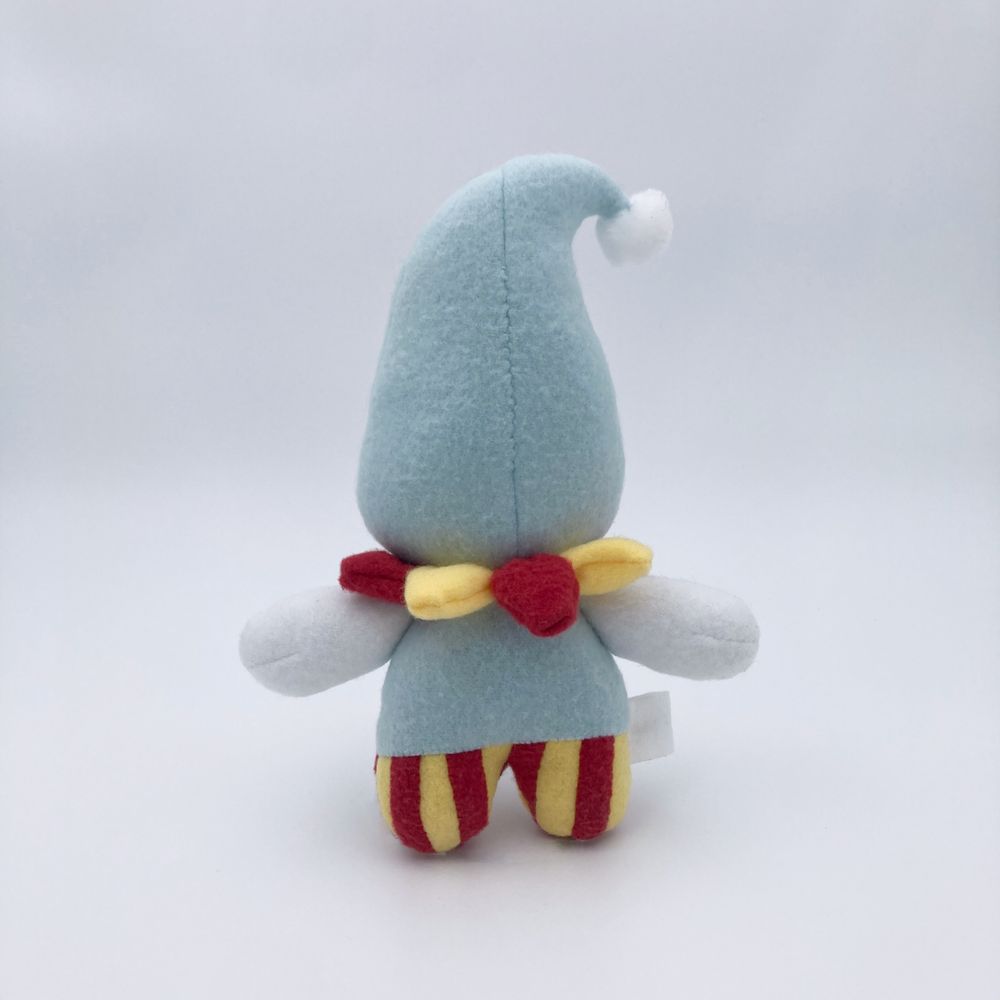 photo of a clown plushie with droopy eyes and a light blue and red and yellow striped color palette. this photo shows the back.