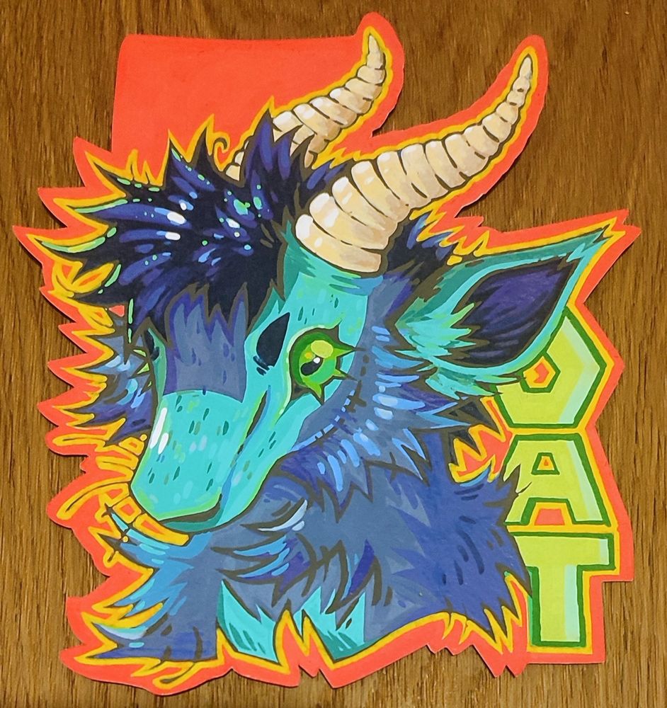 Headshot badge of blue-toned goat character named oat
