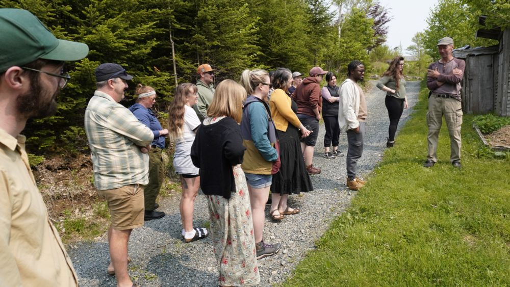 FFNL staff listen to a presentation from Ian at Tree of Life in their gardens