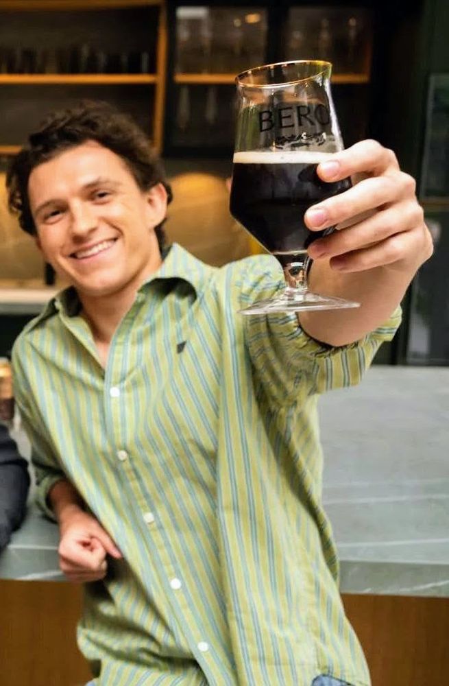 A photo of Tom Holland promoting his collab with RDJ between their brands BERO and Happy Coffee