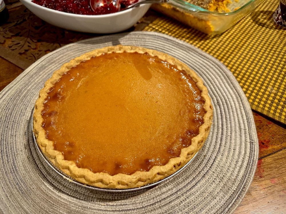 A picture of a golden brown pumpkin custard pie