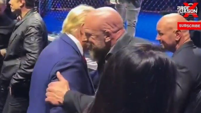 Triple H hugs Donald Trump at a UFC show in the run up to the election. Triple H and Donald Trump are very well versed in scripted outcomes and screwjobs so this makes sense 