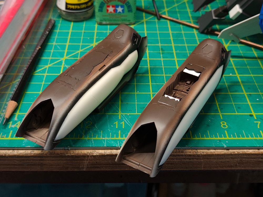 Science fiction nacelles modified with plastic card to facilitate closed gear bay doors. 

These parts have massive seams that required so much extra work to remove and re-scribe. "Caveat Emptor" 