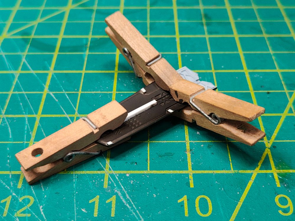 Forward landing gear doors, modified, reinforced, and cemented together with "high tech" clamps holding everything in place.