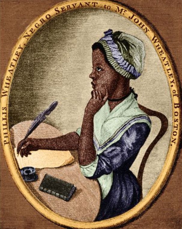Oval portrait engraving of Phillis Wheatley, a young Black woman, seated at a writing desk in profile. She wears a simple 18th-century dress with white neckerchief and cap, thoughtfully touching her chin with one hand while holding a quill pen over paper with the other. An inkwell and small book rest on the table. Surrounding the oval is the caption: “PHILLIS WHEATLEY, NEGRO SERVANT TO MR. JOHN WHEATLEY, OF BOSTON.”