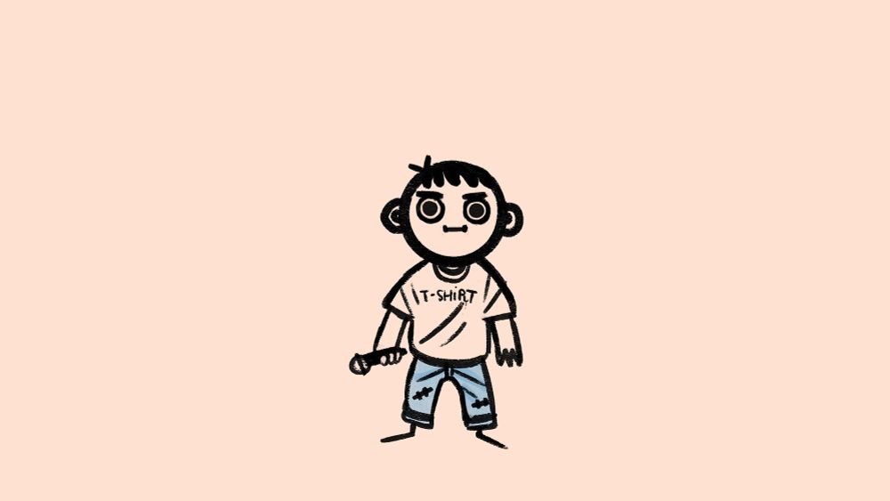 A cartoony drawing of Kyungsoo, standing like a bristling cat, feigning anger. He’s wearing a t-shirt that says “T-SHIRT”, and torn-up jeans, holding a mic in his right hand.
