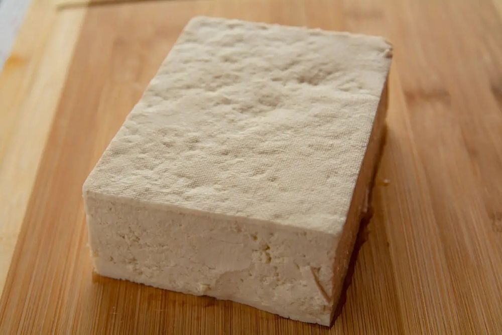 A block of unprepared tofu.