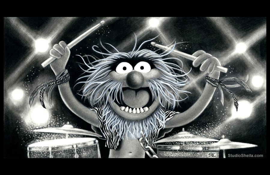 A very excited Animal from The Muppets sitting behind his drum set.