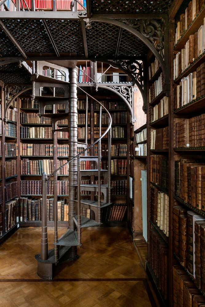 The Nottebohm room at the Hendrik Conscience Library. A cast iron winding staircase in a little corner. Old books all around.