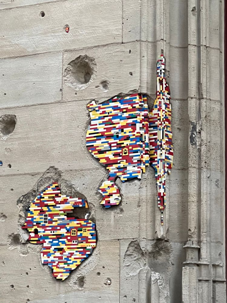 Ww2 battle damage in Rouen filled with Lego bricks