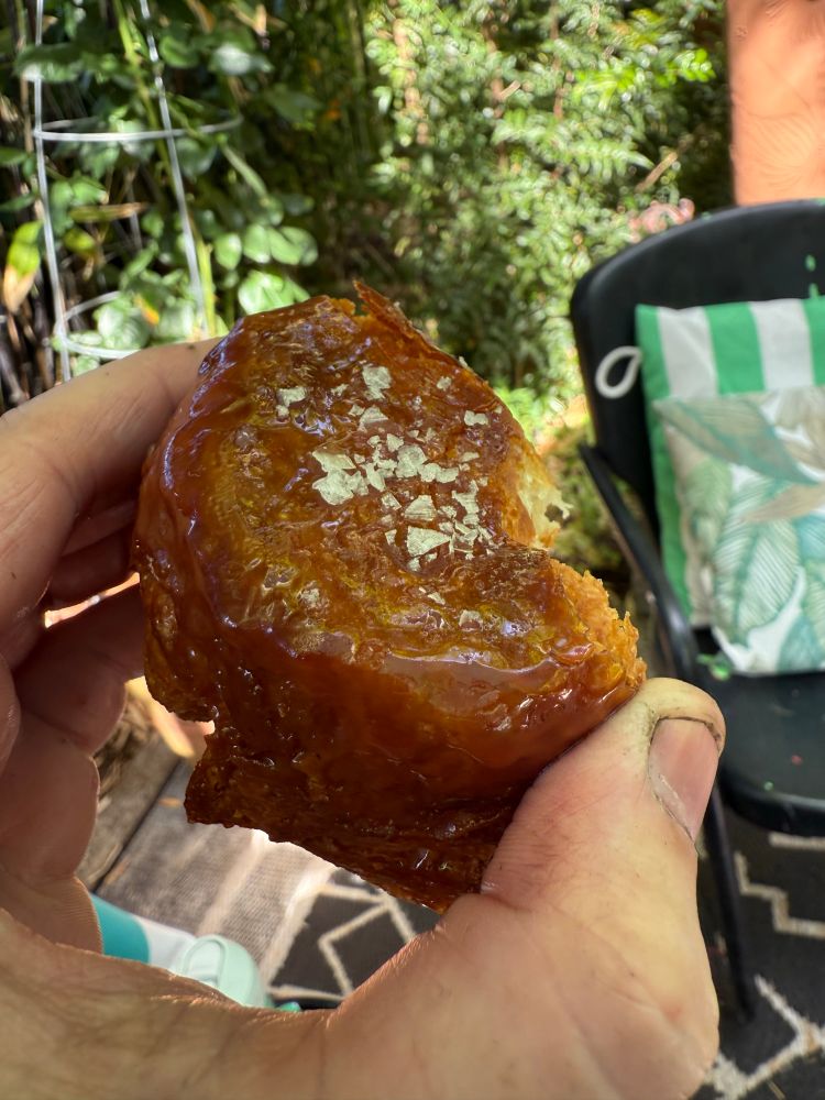 A half eaten kouign amann