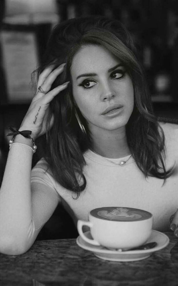Lana Del Rey drinking a coffee