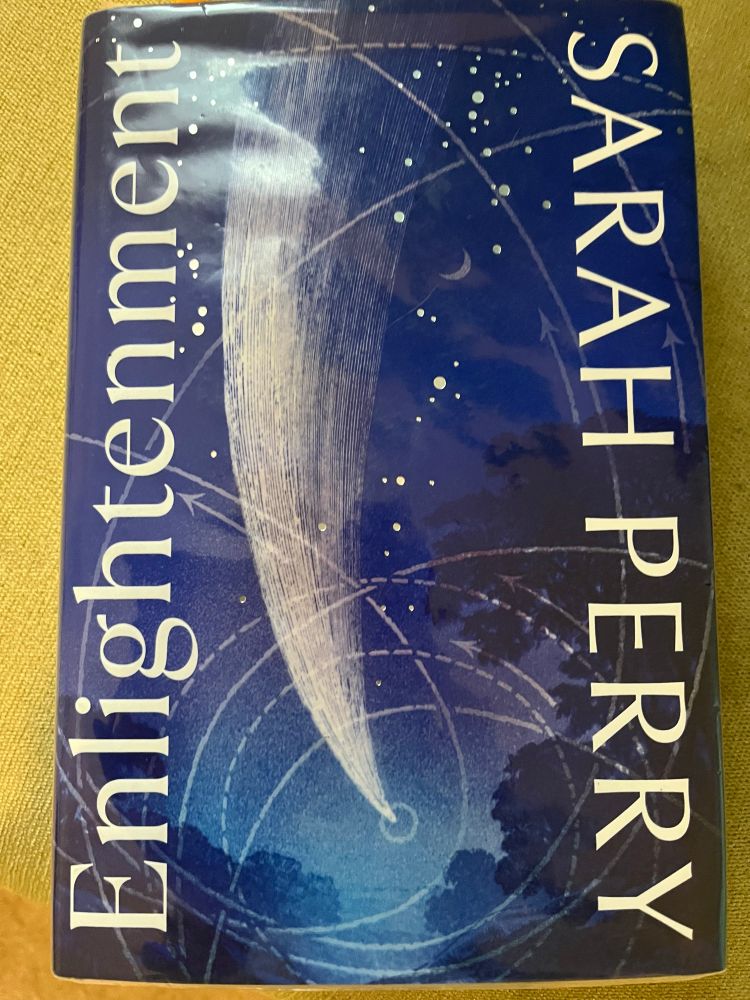 The cover of Enlightenment, featuring a stylised image of a comet against a dark blue sky 