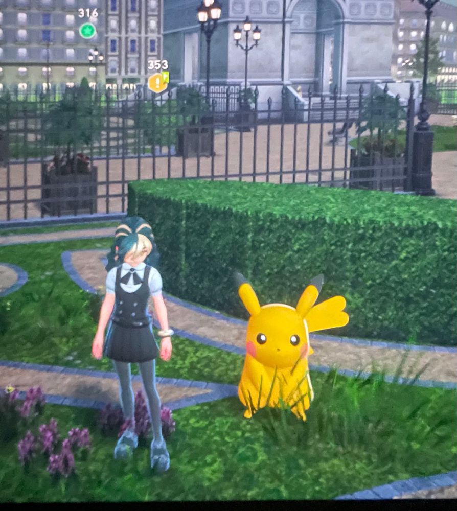 Shiny alpha pikachu next to my character 