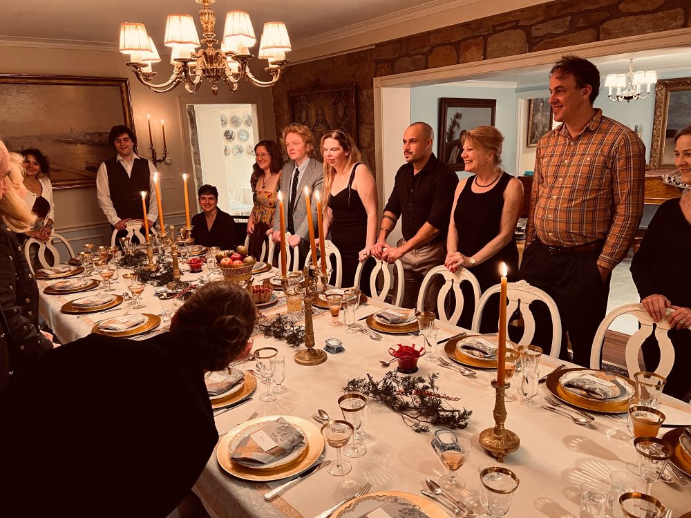 Our family gathers around the table for a Thanksgiving feast