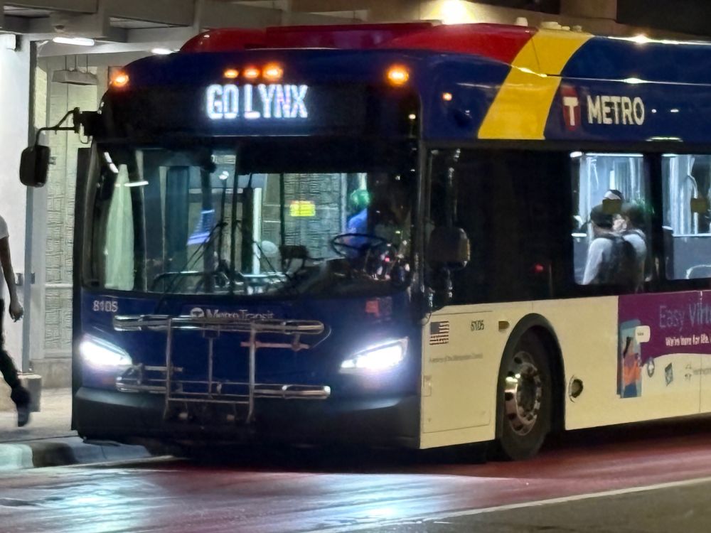 A metro transit bus that says go Lynx on the front electric sign 