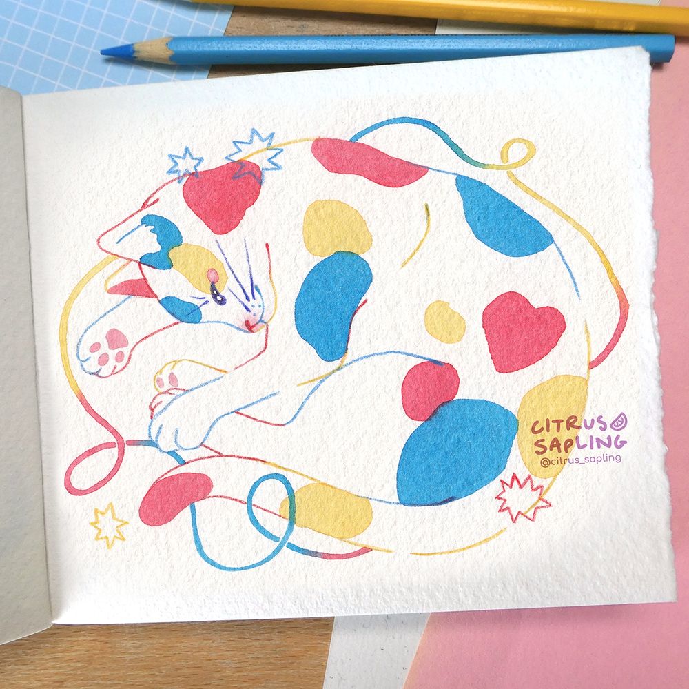 A watercolour painting of a calico cat curled up sleeping on its side, painted in red blue and yellow. There's a twisty piece of string and stars around it. 