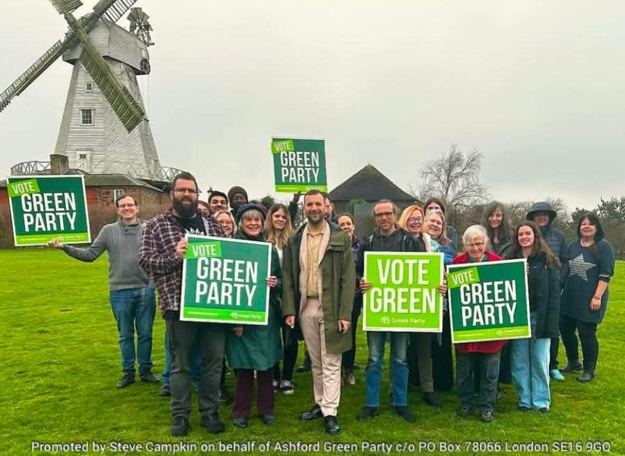 Zack and the Ashford Greens outside a windmill