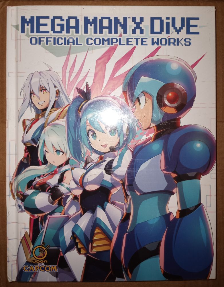 Mega Man X DiVE Official Complete Works book.
Characters shown on the front cover from back to front: ViA■, iCO, RiCO, Mega Man X.