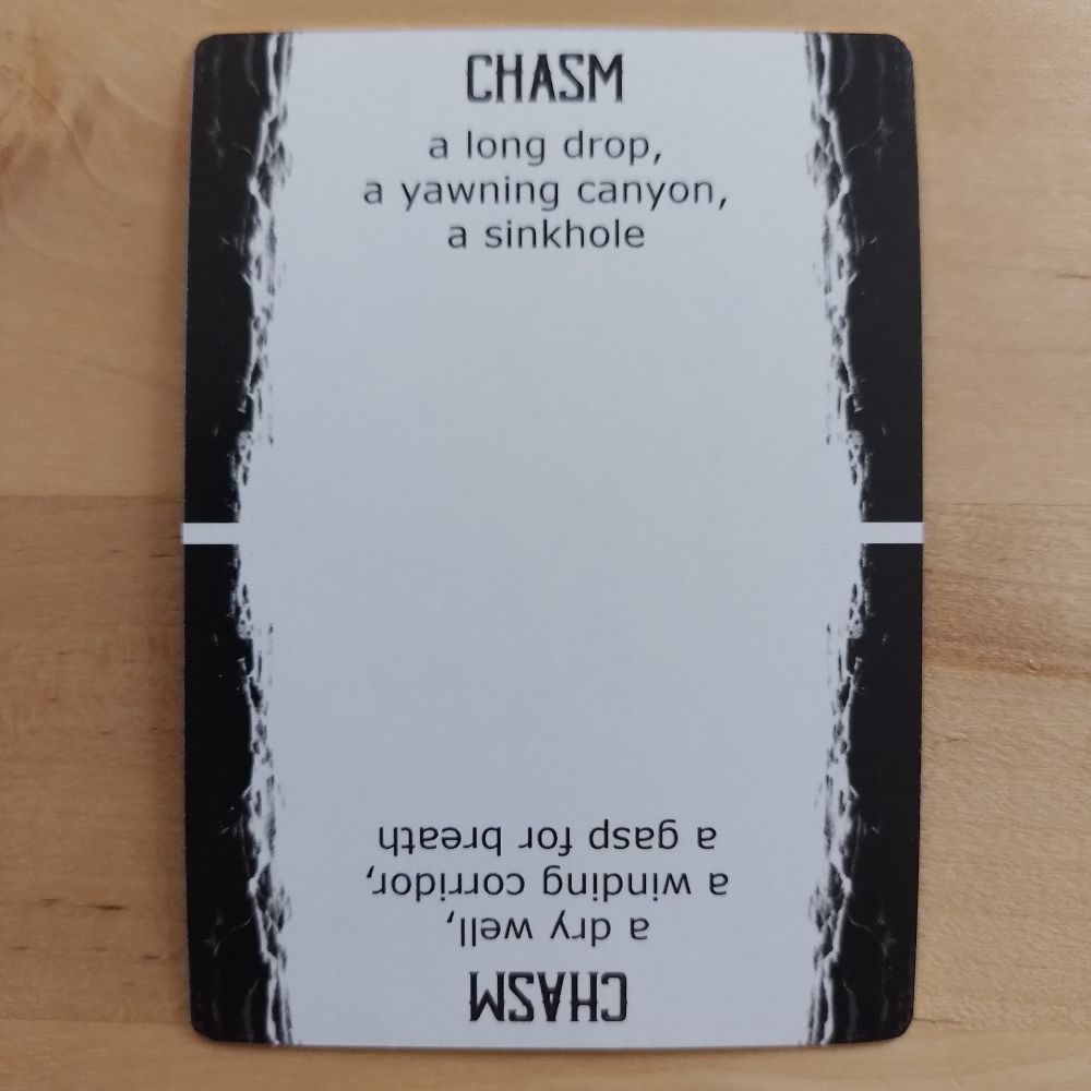 A Spindlewheel card, Chasm: a long drop, a yawning canyon, a sinkhole; or (reversed) a dry well, a winding corridor, a gasp of breath