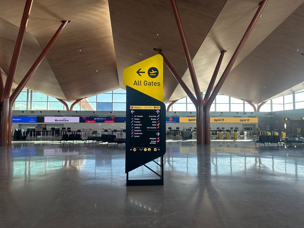 Signage in the new terminal featuring Pittsburgh's signature colors, black and gold
