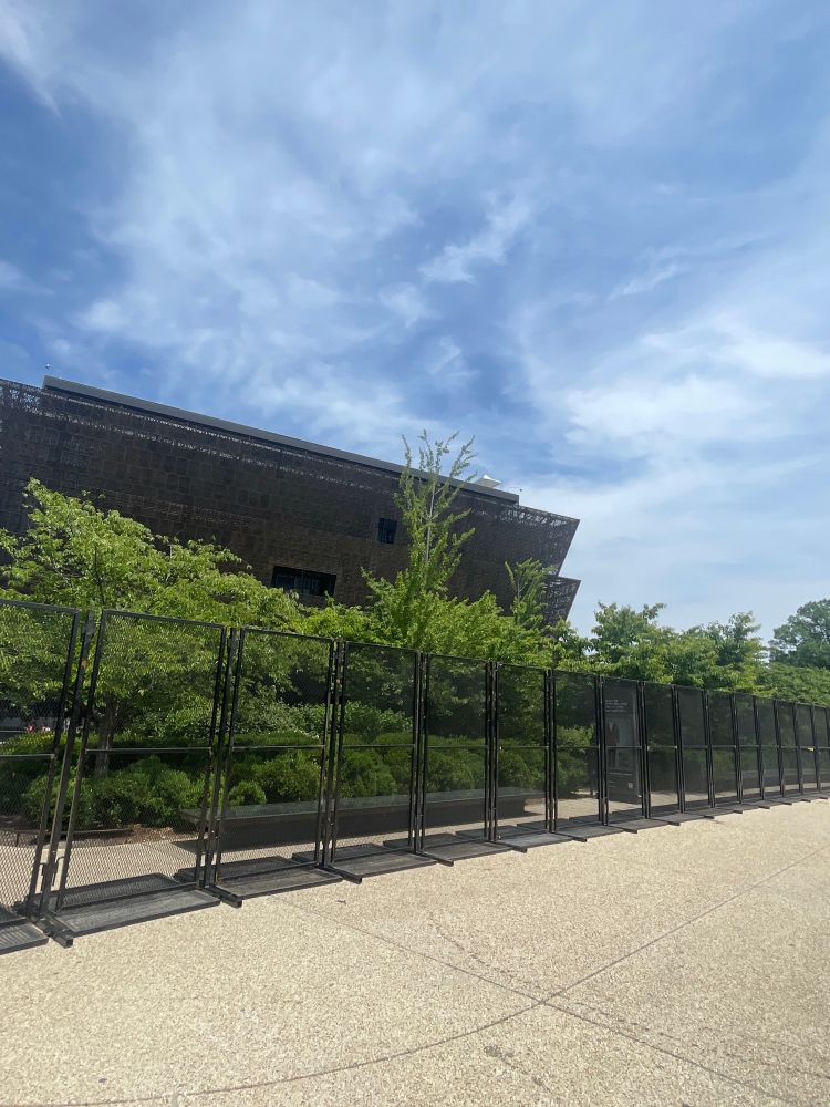 Photo of the Smithsonian African-American Museum, surrounded by metal security barricades