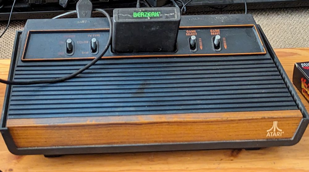 An Atari 2600 with Berserk in the cartridge slot 