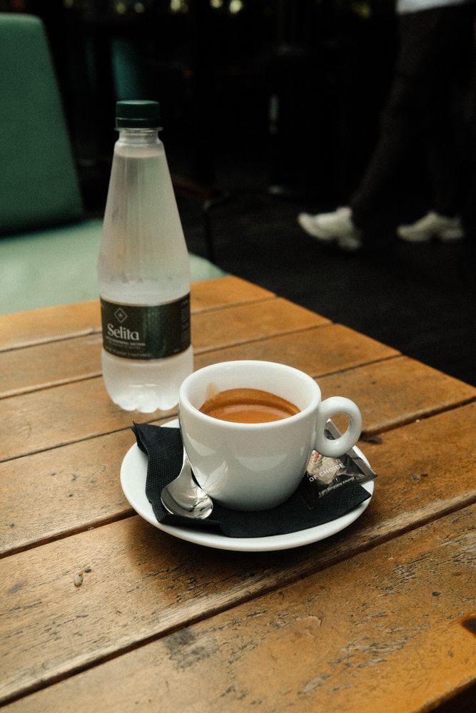 Photo of an espresso and bottle of water. Nothing exciting at all. 