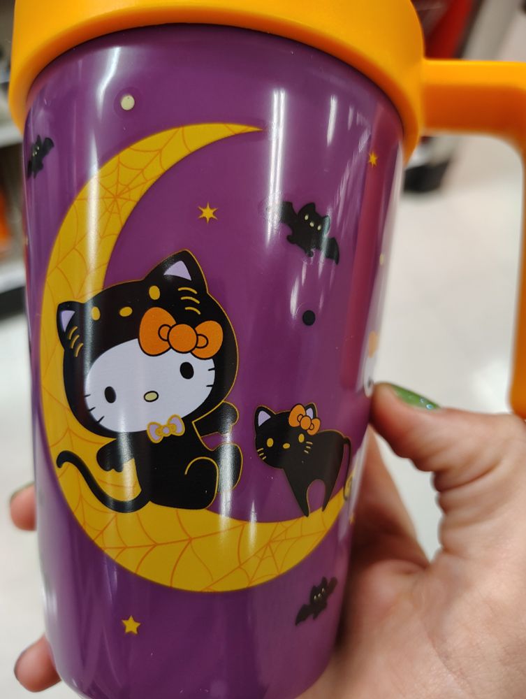 Hello Kitty wearing a black cat costume, which raises some questions.