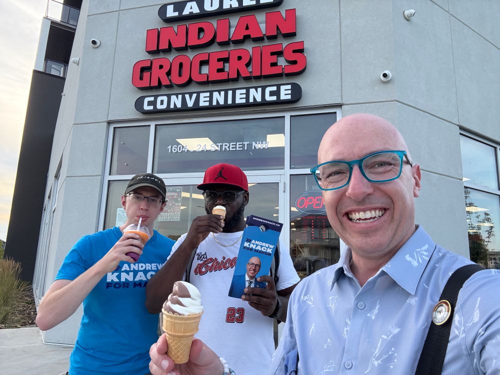 Andrew, Christian, and Ryan standing outside of the store holding ice cream and a slurpee.
