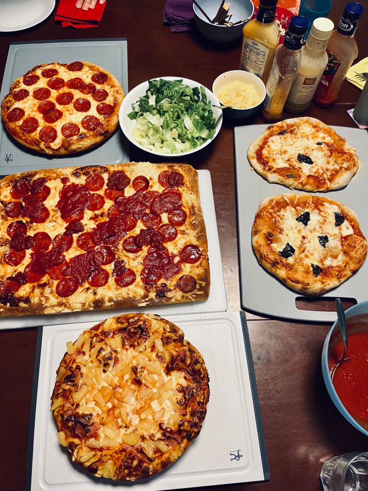 5 pizzas (with two more off camera in the oven)