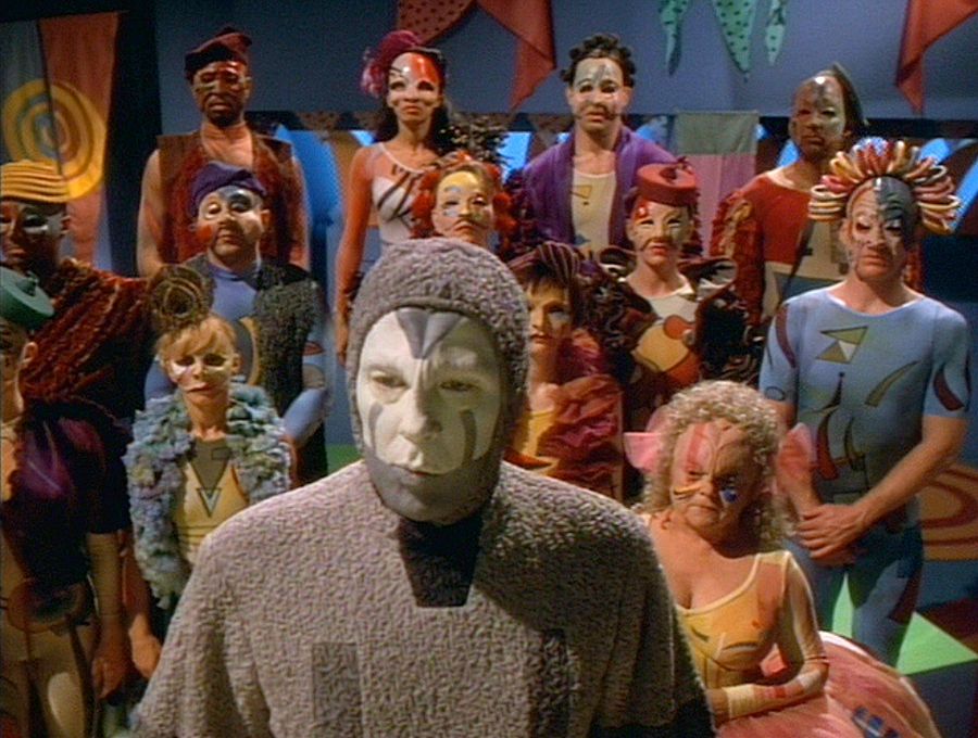 Michael McKean as the psychotic computer-generated clown from the Voyager episode "The Thaw," with various oddly-dressed alien creatures behind him