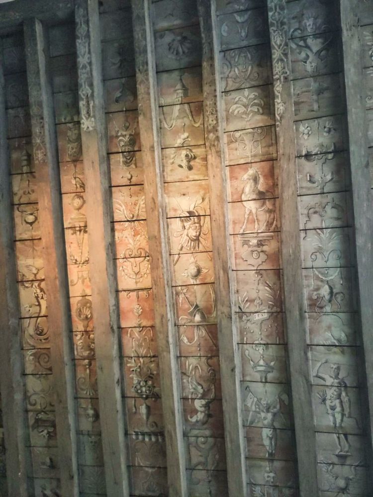 Detail of the early painted ceiling found in Merchiston Tower, Edinburgh, featuring a variety of figures, items, and grotesques. 
