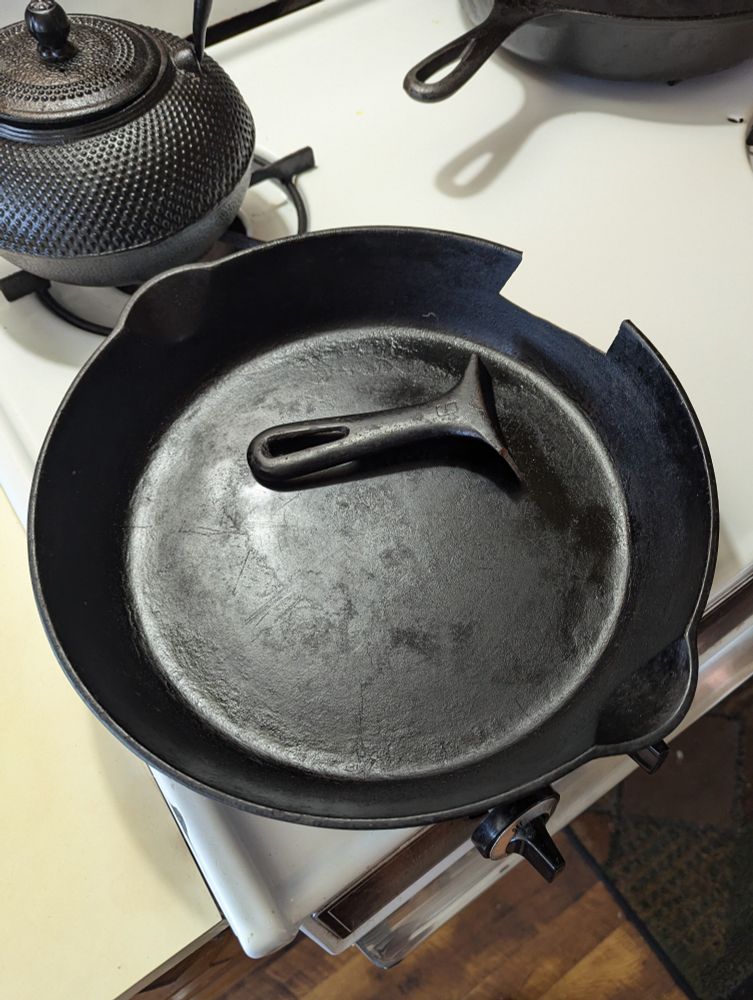 9 inch cast iron pan with the handle snapped off in the pan.