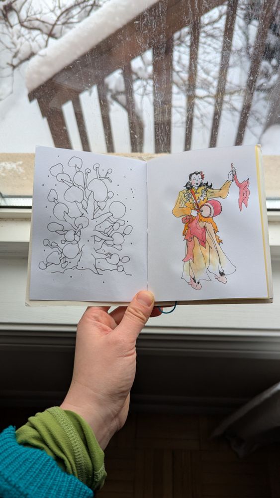 hand holding small sketchbook open to a line drawing of large tree with boughs of snow/ a watercolour painting of the artists mother practising yaogu (chinese waist drum)