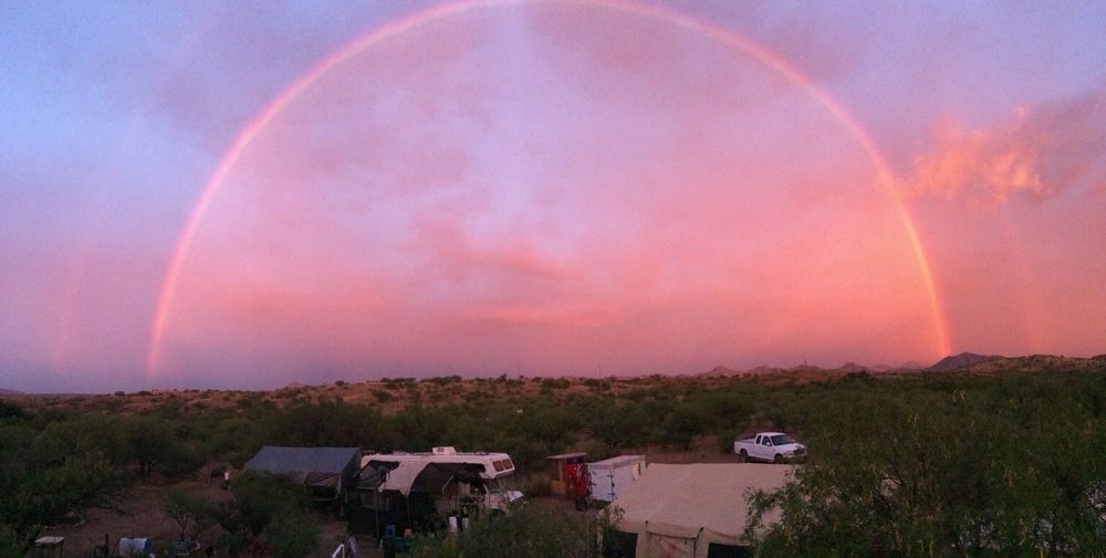 Rainbow over a desert aid camp