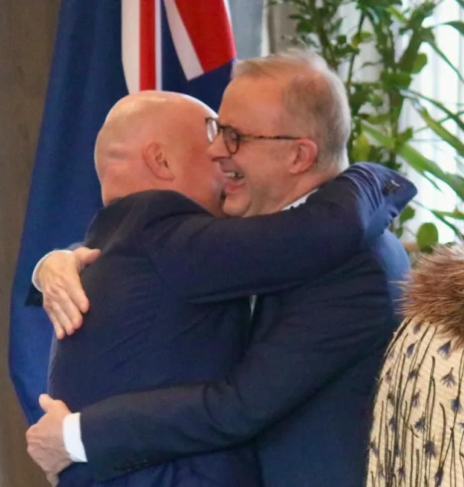 Chris Luxon greeting Australian PM, Anthony Albanese, with an unconventional method. A hug. 