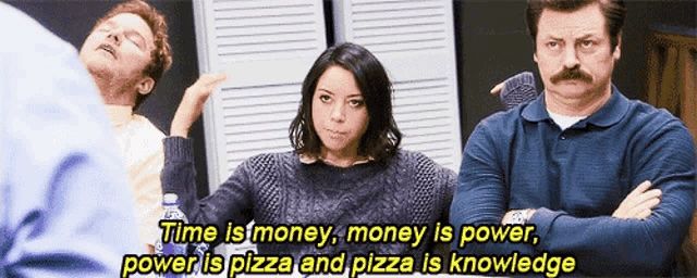 Scene from the show Parks and Recreation facing characters at a conference table. Andy is sitting with head back and eyes closed, April is next to him with her hands up, and Ron is sitting next to her with his arms crossed looking annoyed. The caption is April saying, "Time is money, money is power, power is pizza, and pizza is knowledge."