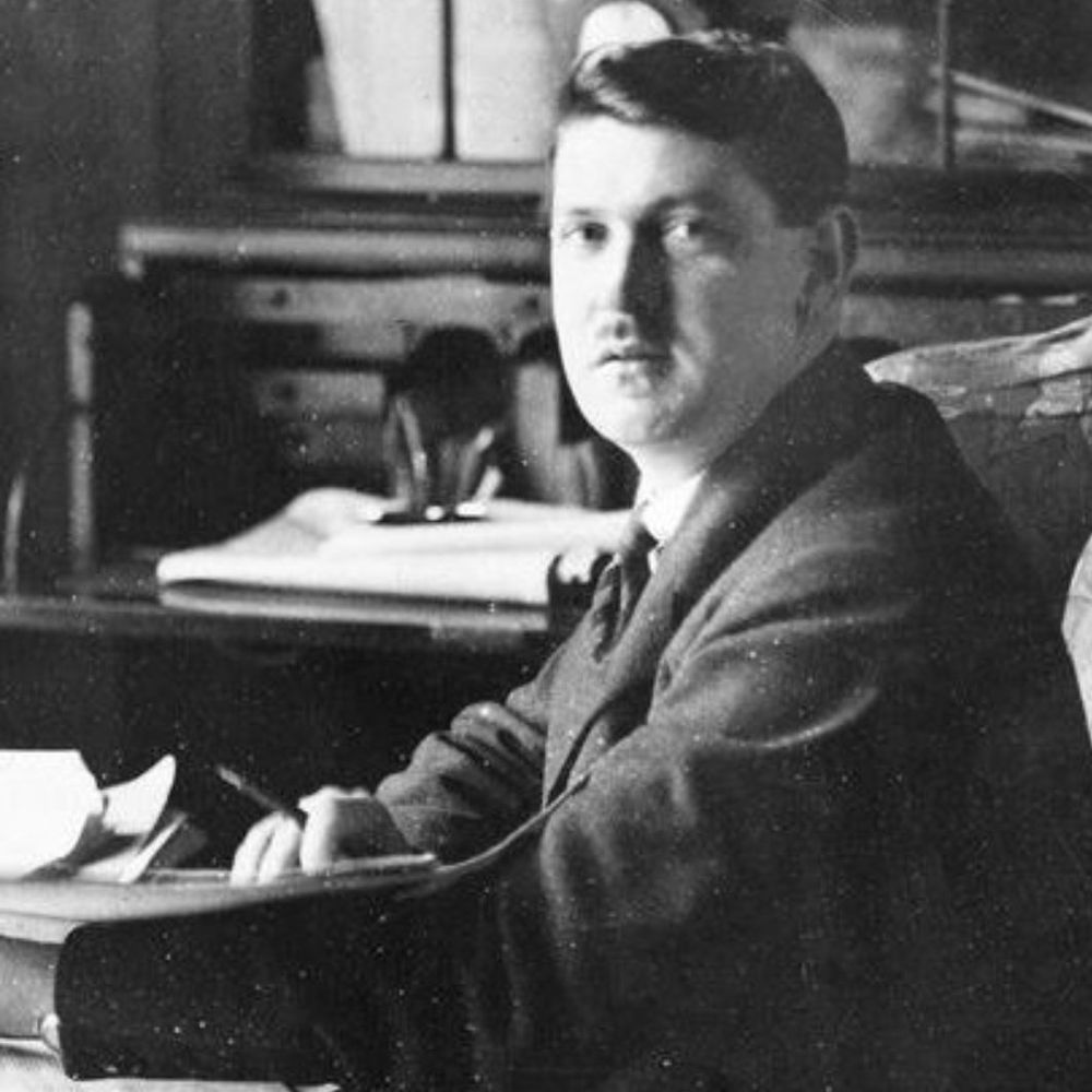 Michael Collins at a desk.